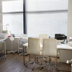 Empty Doctors Office Viewed Through Open Door